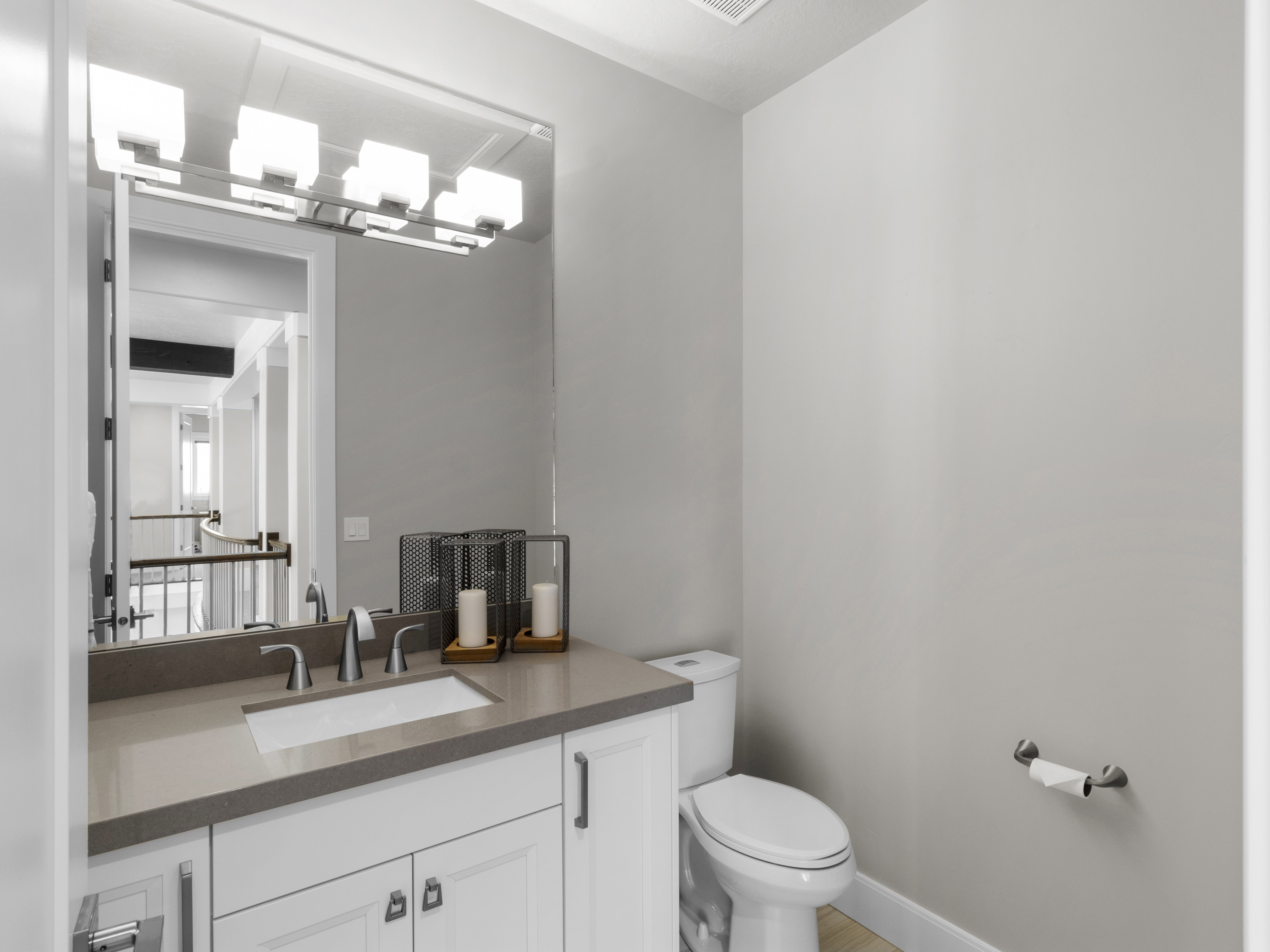 Half bath with vanity and toilet