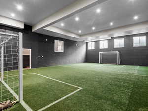View of property's community with an area for soccer, recessed lighting, and a raised ceiling