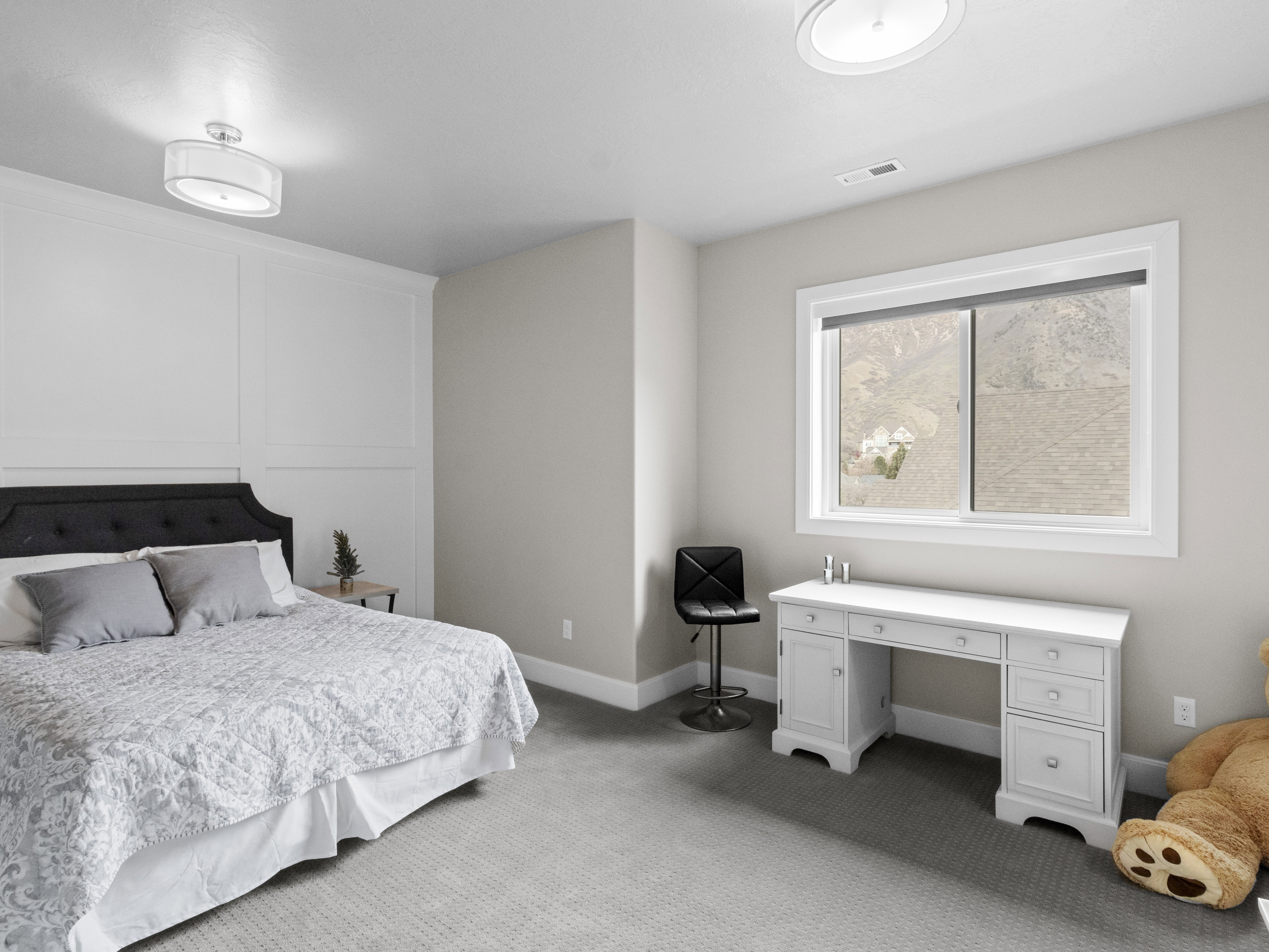 Bedroom featuring carpet floors and a desk