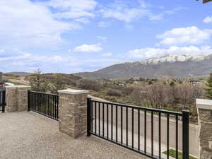 Gate with a mountain view and a balcony