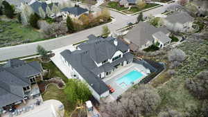 Aerial view of residential area featuring a pool area