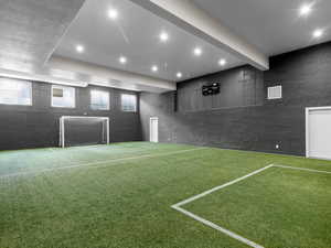 View of community with an area for sports, recessed lighting, and beam ceiling