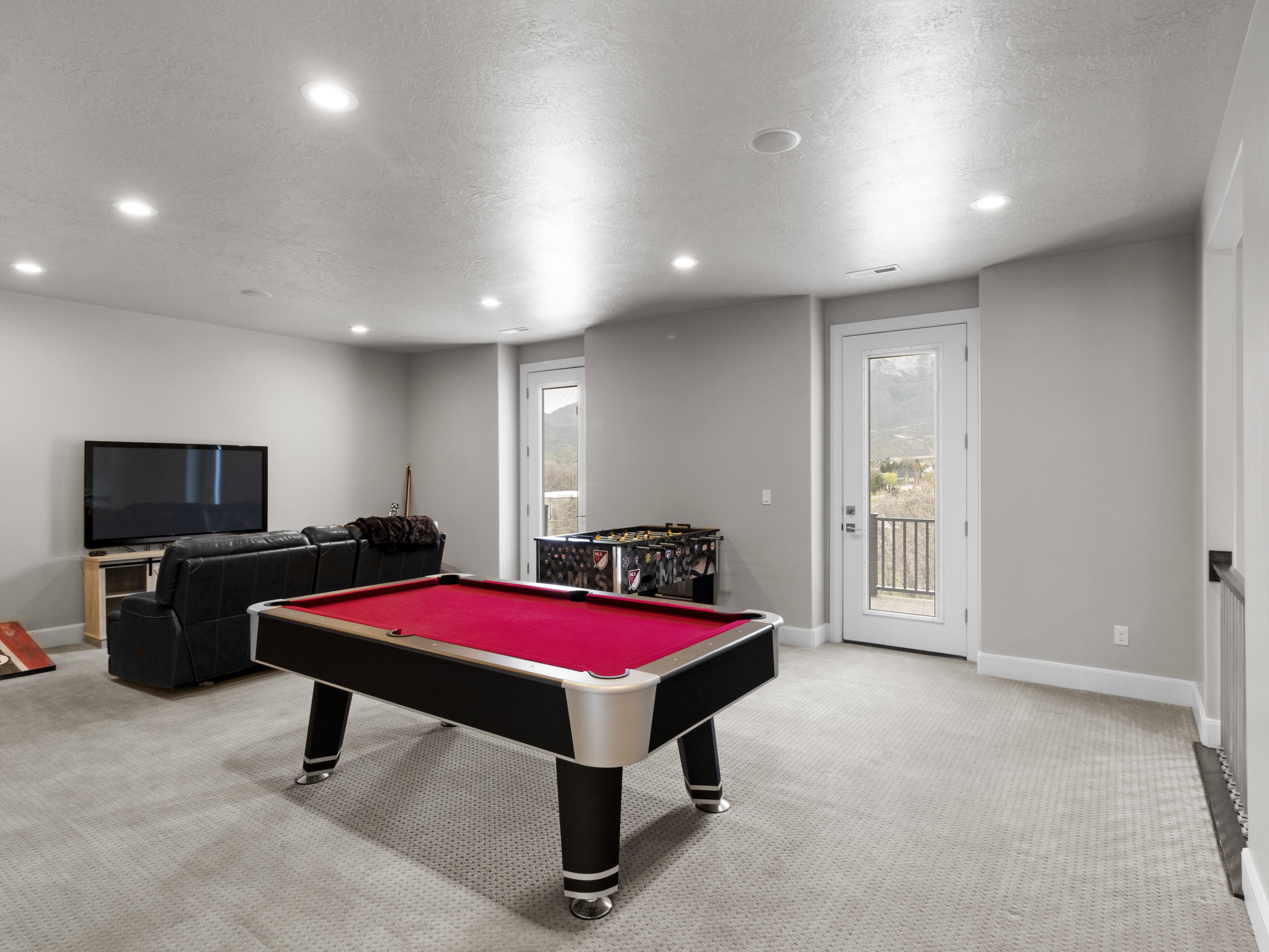 Playroom featuring light colored carpet, pool table, recessed lighting, and a textured ceiling
