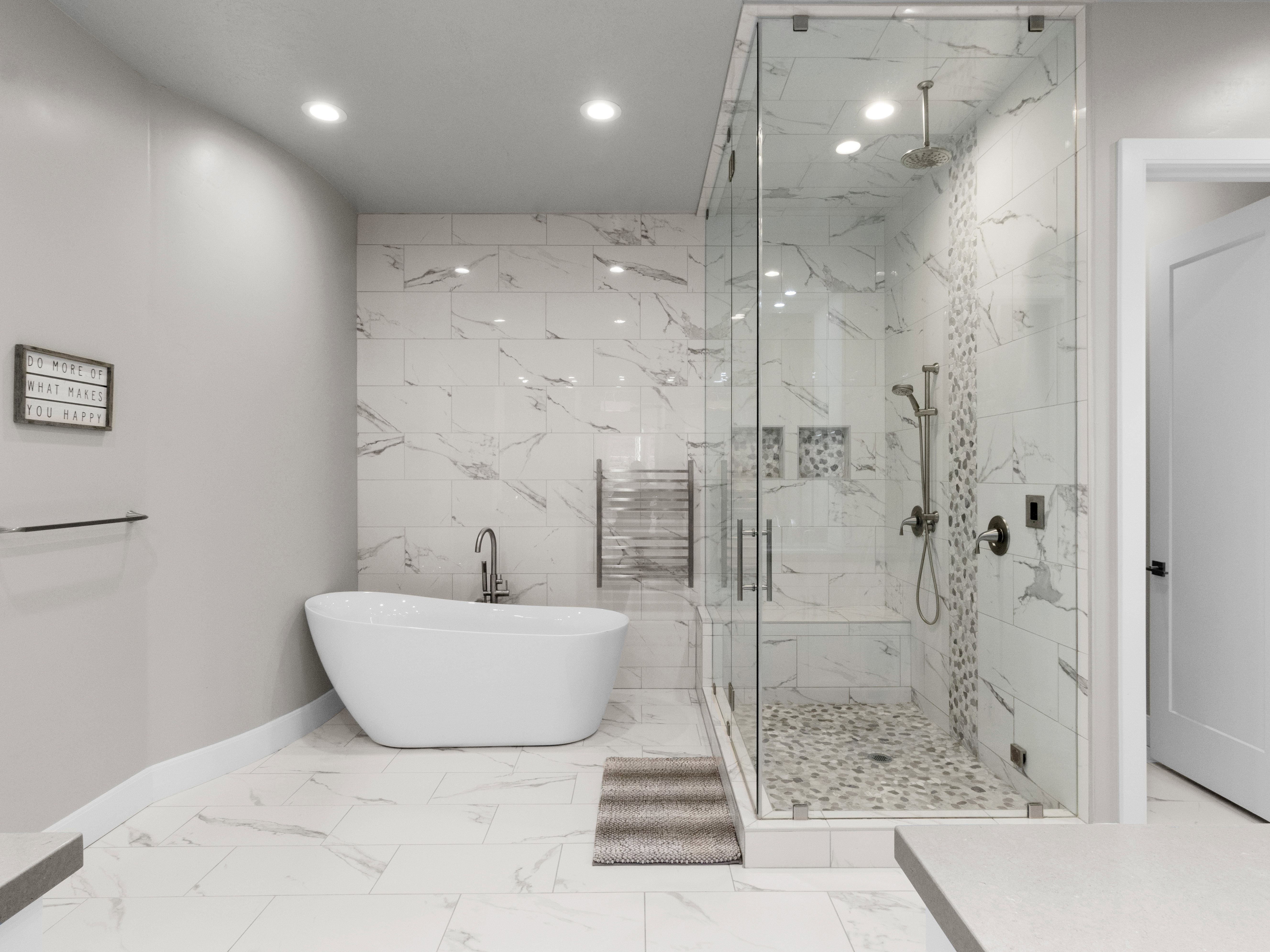 Full bathroom with a soaking tub, a marble finish shower, recessed lighting, radiator heating unit, and tile walls