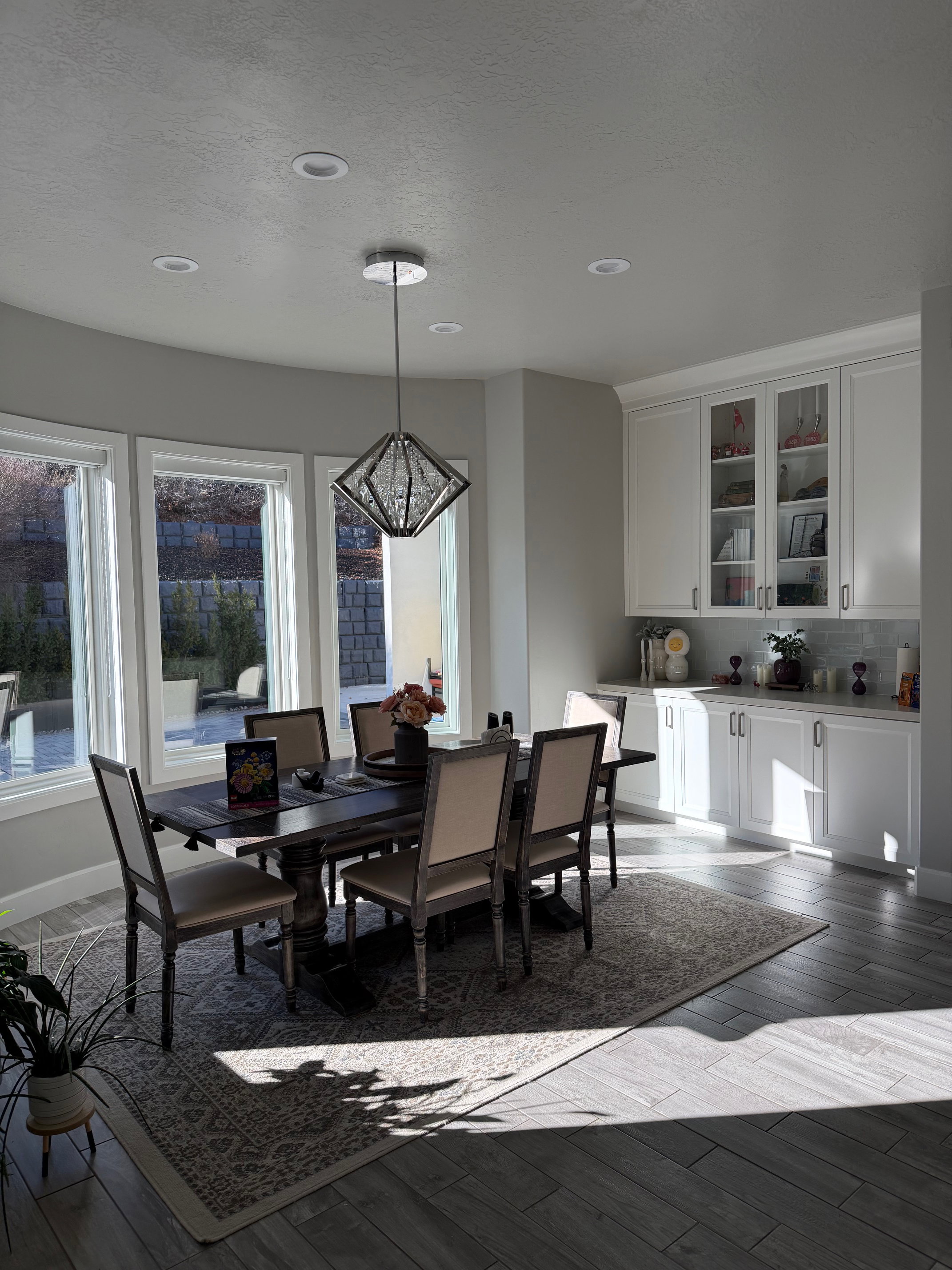 Dining room featuring light wood-type flooring and hanging lights