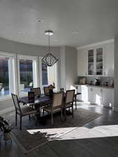 Dining room featuring light wood-type flooring and hanging lights