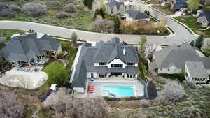 Aerial view of residential area featuring a pool area