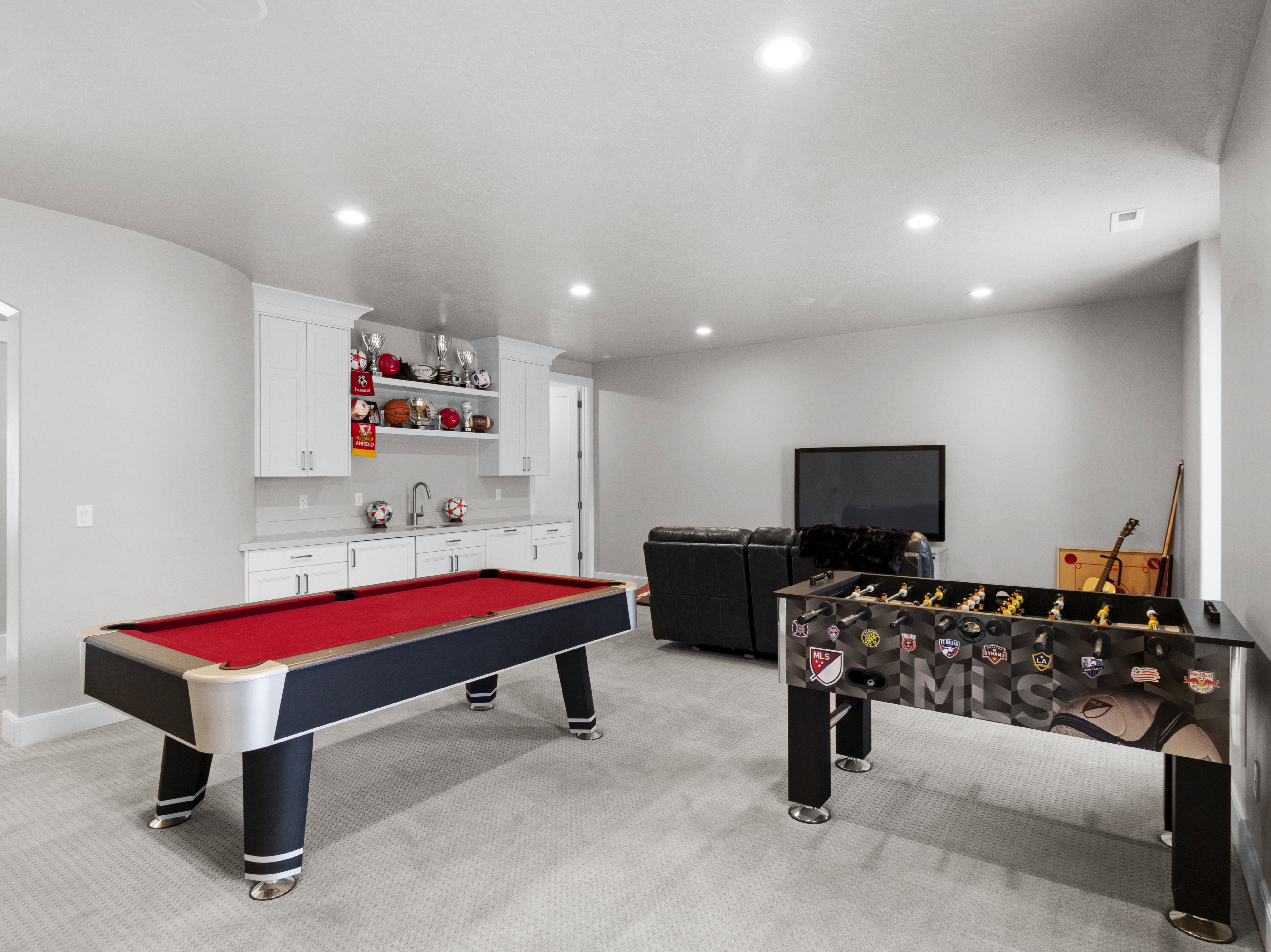 Recreation room featuring light colored carpet, bar with sink, recessed lighting, and pool table