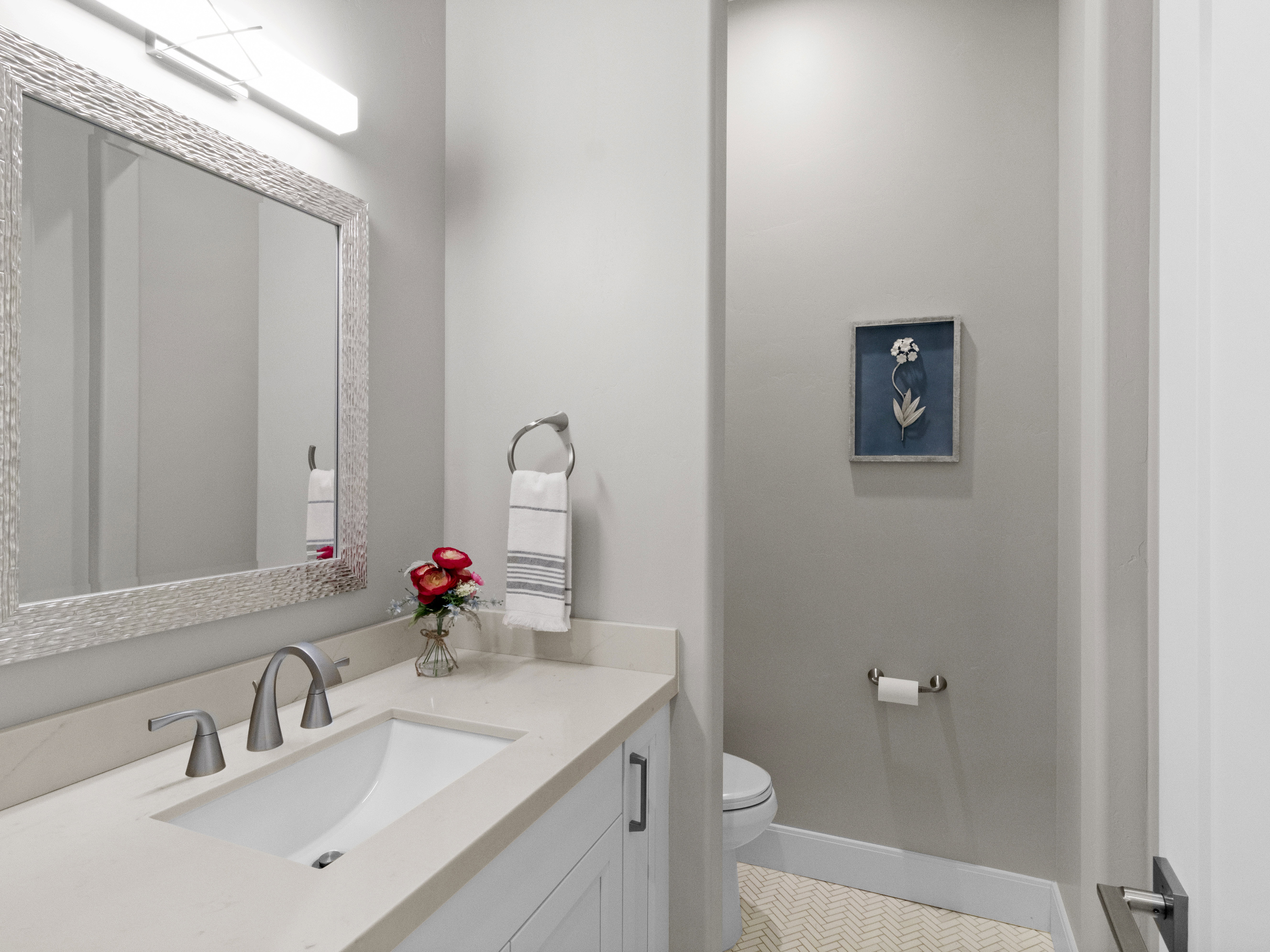 Half bath with vanity and toilet