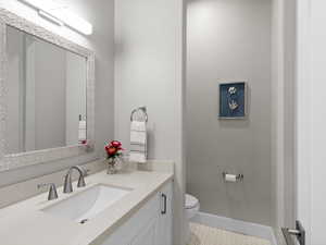 Half bath with vanity and toilet