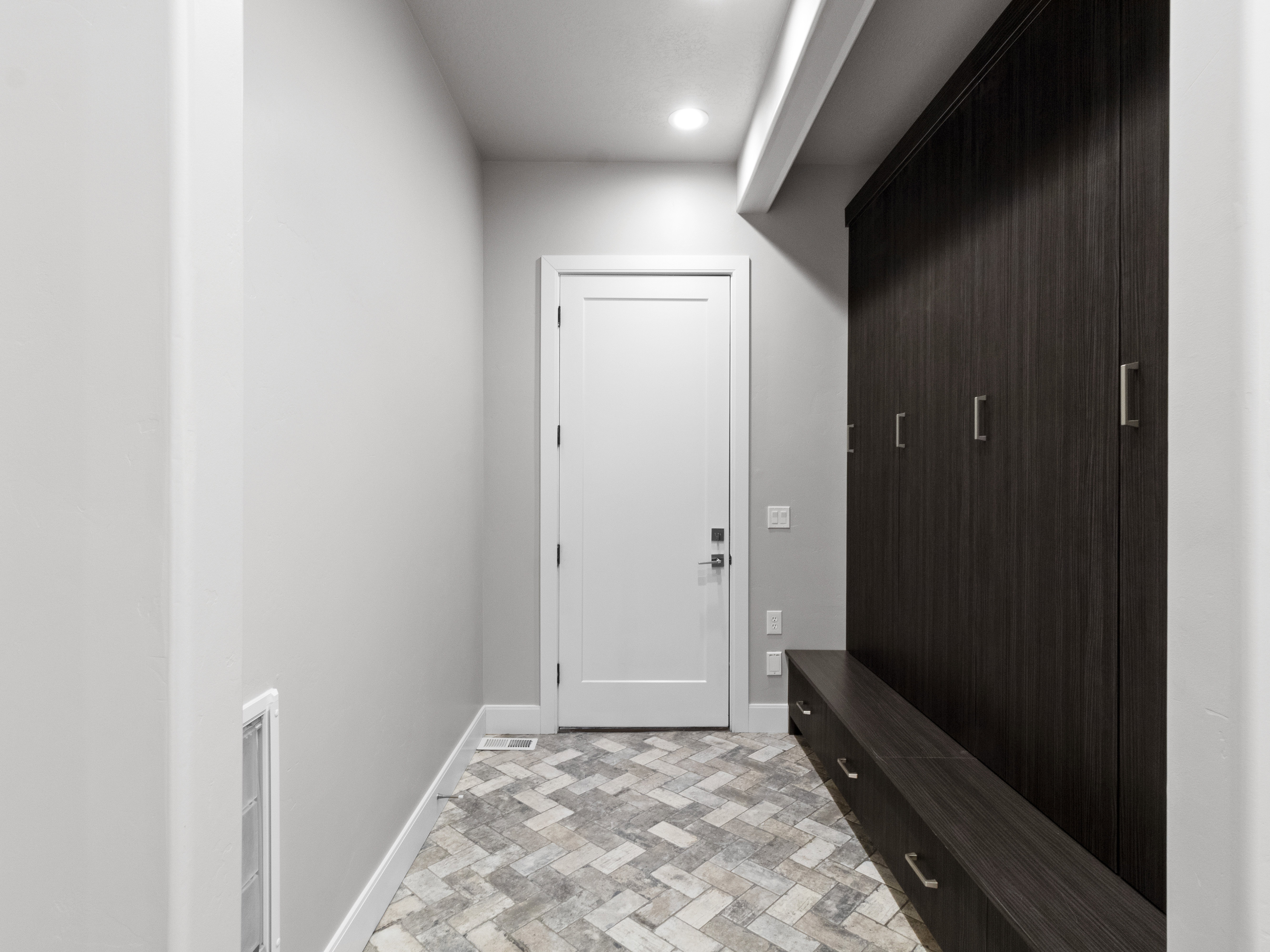 Mudroom featuring baseboards and recessed lighting