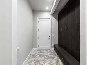 Mudroom featuring baseboards and recessed lighting