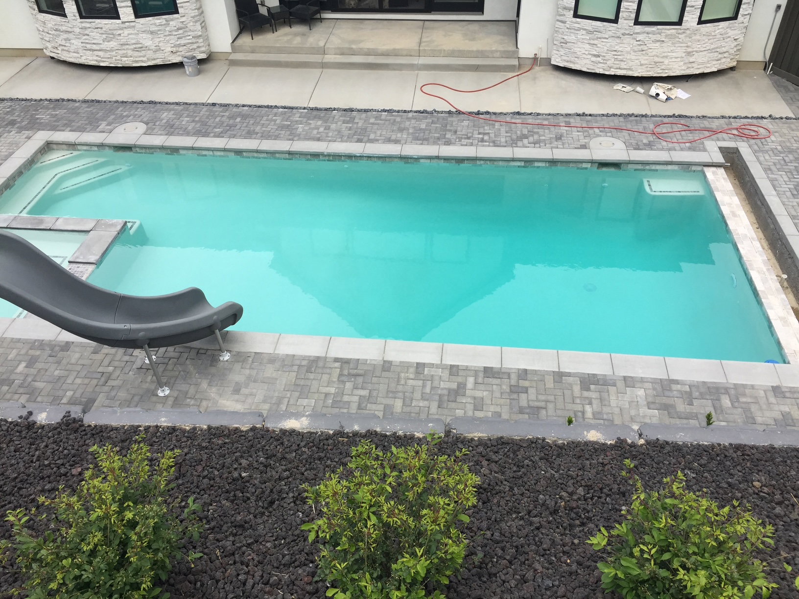 Integrated pool / hot tub with a patio
