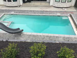 Integrated pool / hot tub with a patio