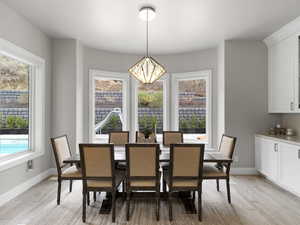 Dining room featuring a chandelier and light wood-style floors