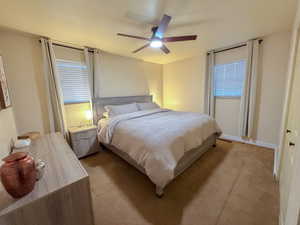 Bedroom with carpet and a ceiling fan