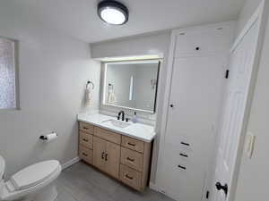 Bathroom with vanity and light tile patterned flooring