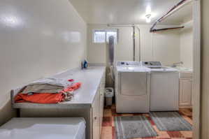Laundry room with washer/dryer, folding counter & cabinet space