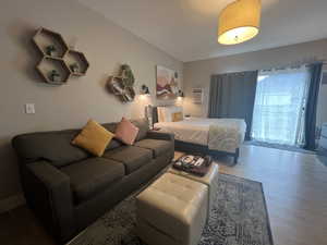 One queen size bed and one twin size pull out couch