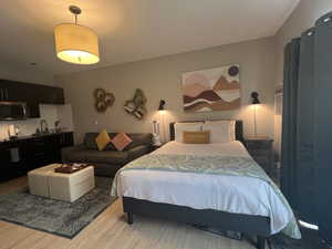 One queen size bed and one twin size pull out couch