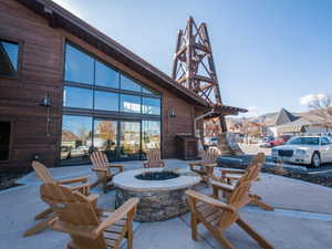 View of patio with an outdoor fire pit
