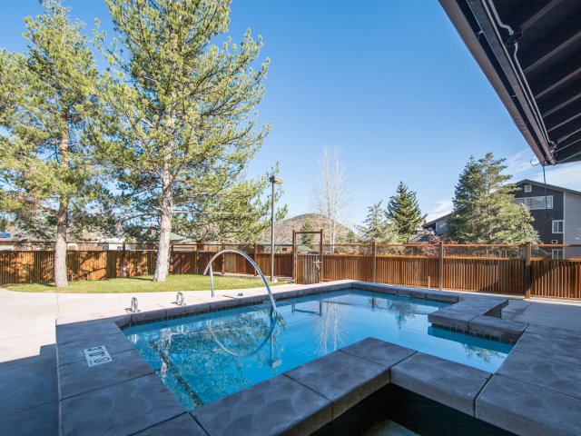 View of pool with a fenced backyard and patio surround