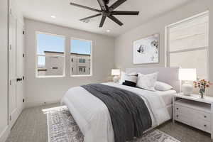 Bedroom with carpet flooring, a ceiling fan, and recessed lighting