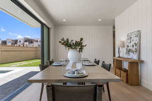 Dining area featuring light wood-style flooring and recessed lighting