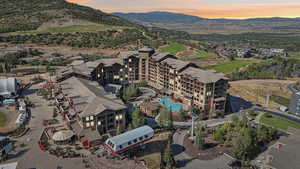 Aerial view of a mountainous background and a golf course