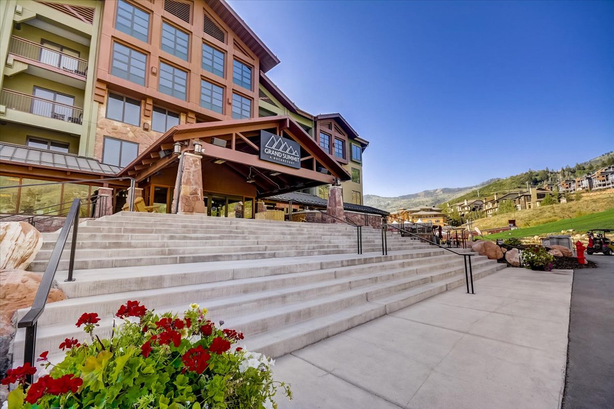 View of property's community with a patio and a mountain view