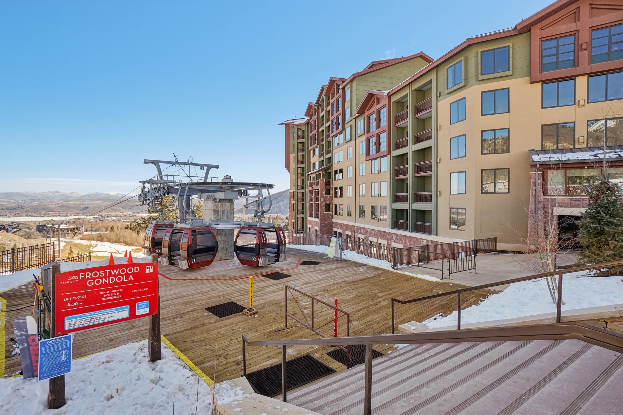 View of community featuring a deck with mountain view