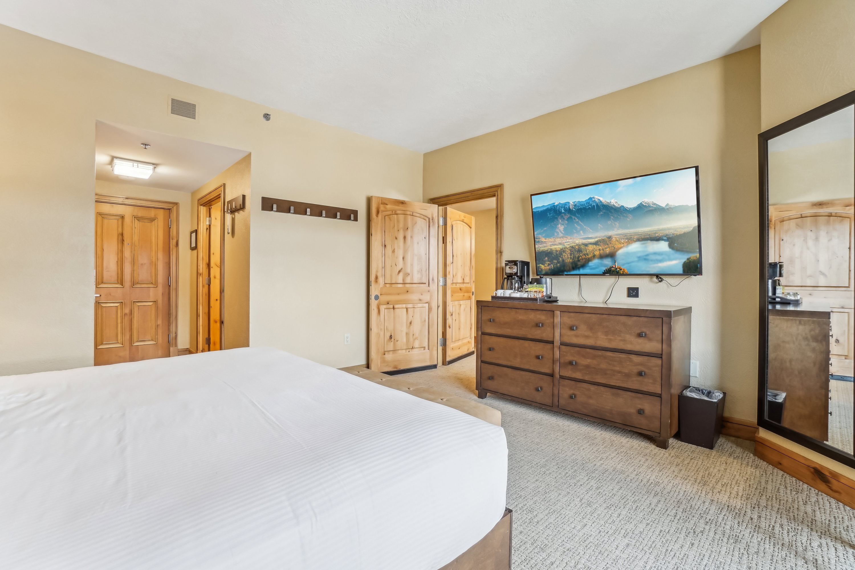 Bedroom with light colored carpet