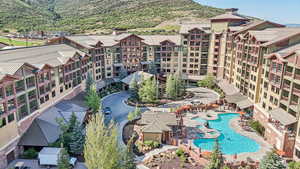 Bird's eye view of a mountainous background and a pool