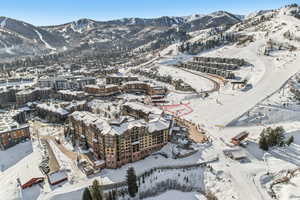 Snowy aerial view featuring a mountain view