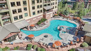 Community pool with a patio