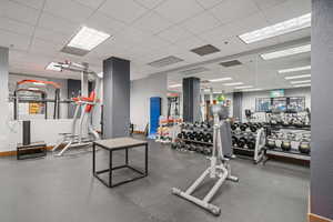 Workout area with a paneled ceiling