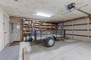Garage featuring a garage door opener
