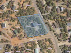 Aerial overview of property's location featuring property boundaries highlighted