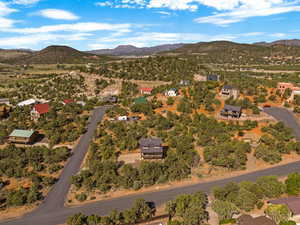 Aerial overview of property's location with mountains