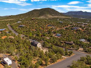 Aerial view of residential area featuring a mountainous background