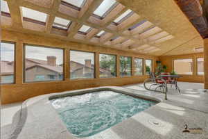 View of pool featuring an in-ground hot tub