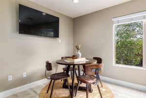 Dining room featuring light wood-style floors and recessed lighting