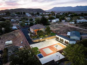 Aerial view of property's location with mountains and nearby suburban area
