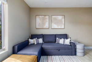 Living room featuring wood finished floors and healthy amount of natural light
