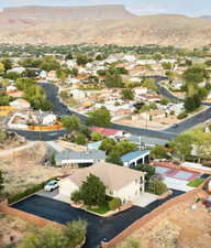 View of property location with a mountain backdrop and nearby suburban area