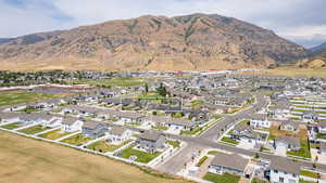 Aerial view of residential area featuring a mountain backdrop
