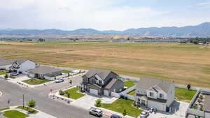 Aerial perspective of suburban area with a mountainous background
