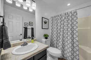 Full bath with vanity and toilet