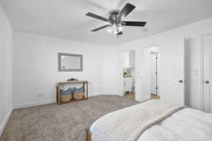 NEWLY carpeted bedroom with ceiling fan, ensuite bathroom, and a walk-in-closet