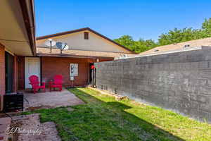 Fenced yard with a patio